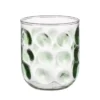 Glas met groene stippen