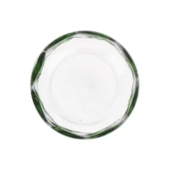 Glas met groene stippen